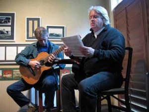 Scott Kritzer with student, studying sheet music